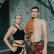 A white man and a white lady clothed in climbing gear