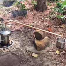 Distillation process taking place in the forest for water to be purified for consumption