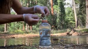 a tablet is dropped in the water for purification