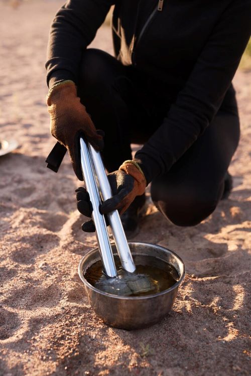 A pot of water going through filtration process for consumption