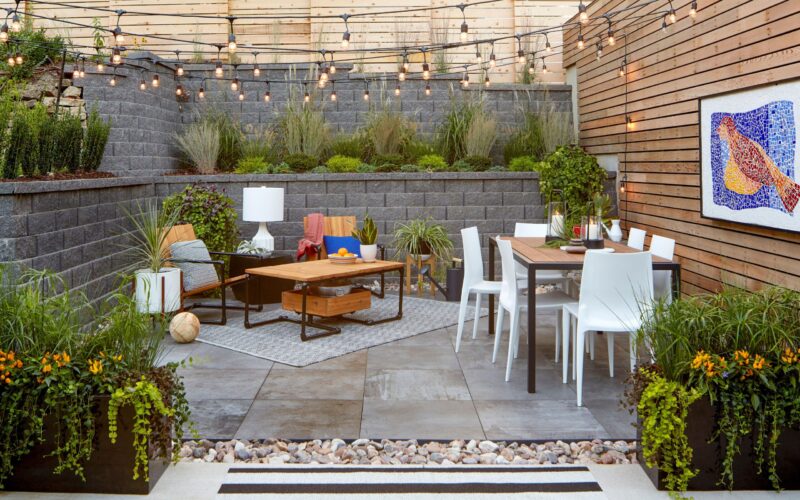 Best way to cover a concrete patio with outdoor rugs and decking tiles for a stylish backyard makeover.
