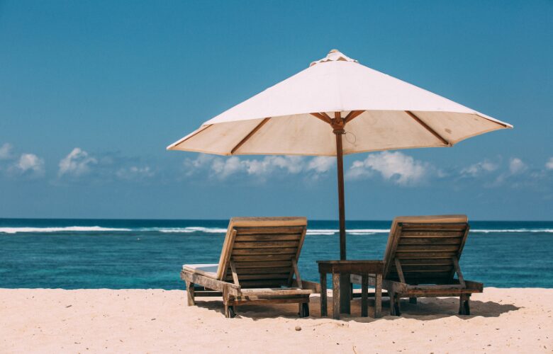 An umbrella providing shade by the beach side.